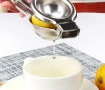 Espremedor amassador de limão e laranja. | Material em aço inox